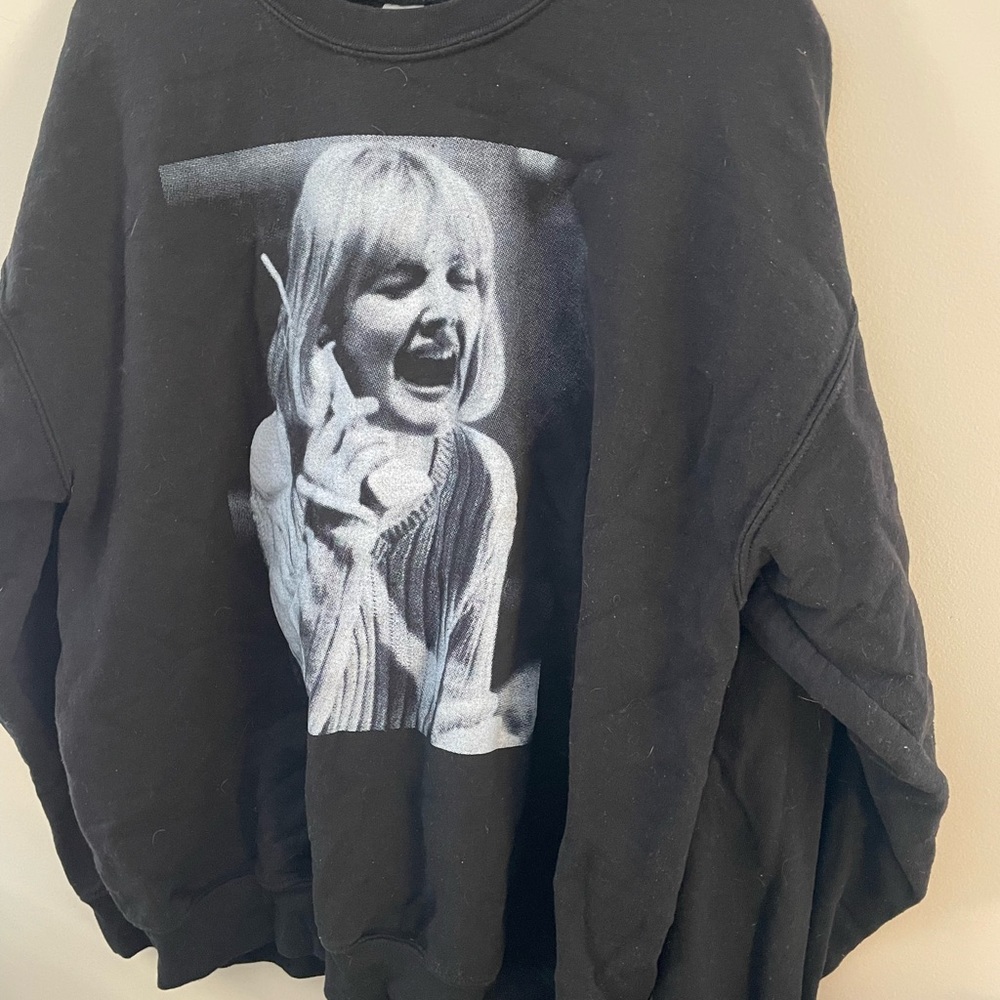 Scream Queen Drew on an iconic sweatshirt